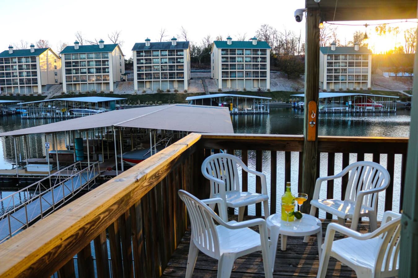 Unwind on the balcony with comfortable seating and a refreshing drink as the sun sets.