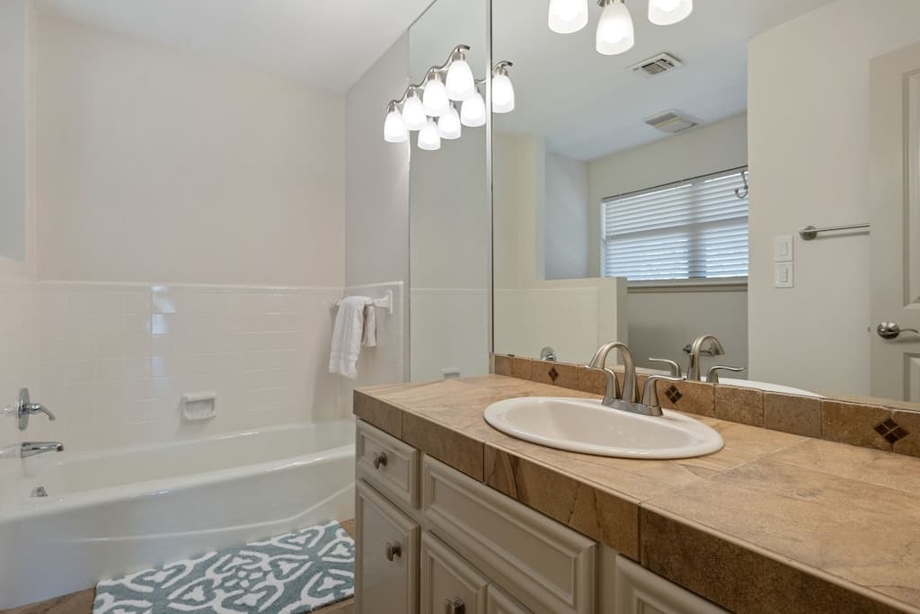 King bedroom 1 - full bath with tub and stand up shower