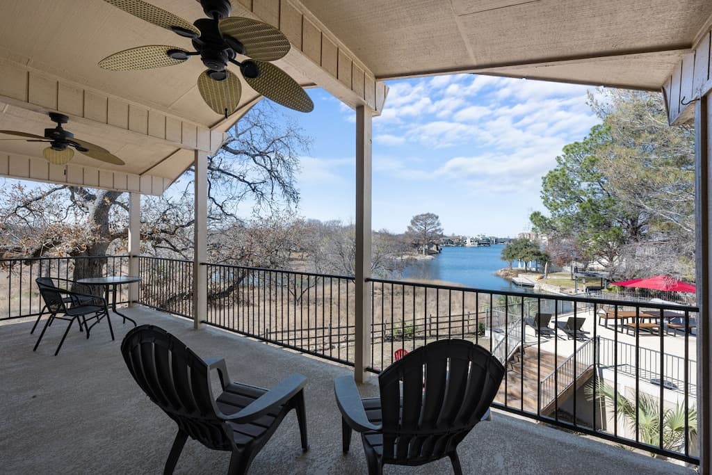 Relax on the upstairs deck with views of the lake outside the 2 king bedrooms