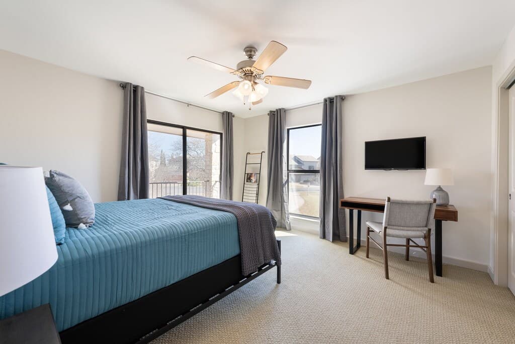 Bedroom 3 - Queen bed with access to balcony, and work space