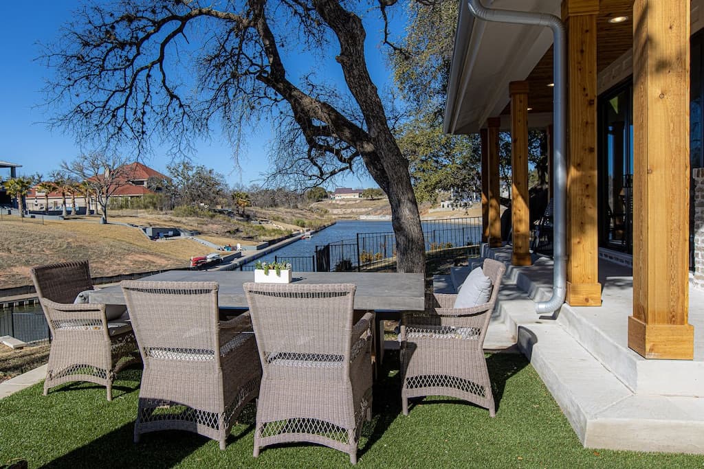 Outdoor dining area with 79” x 40” table and seating for 8