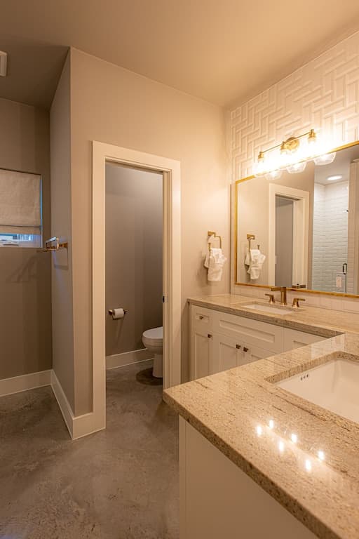 Primary bathroom with stand up shower, double sinks, and soaking tub