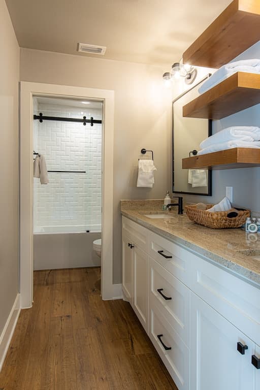Large bathroom with double vanity and separate bath/shower combination