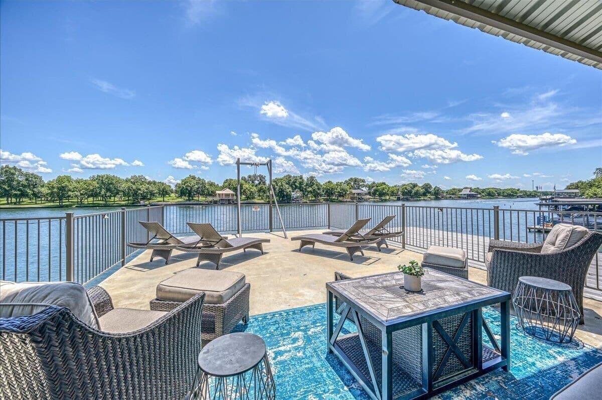 Upper dock with lounge chairs and seating area
