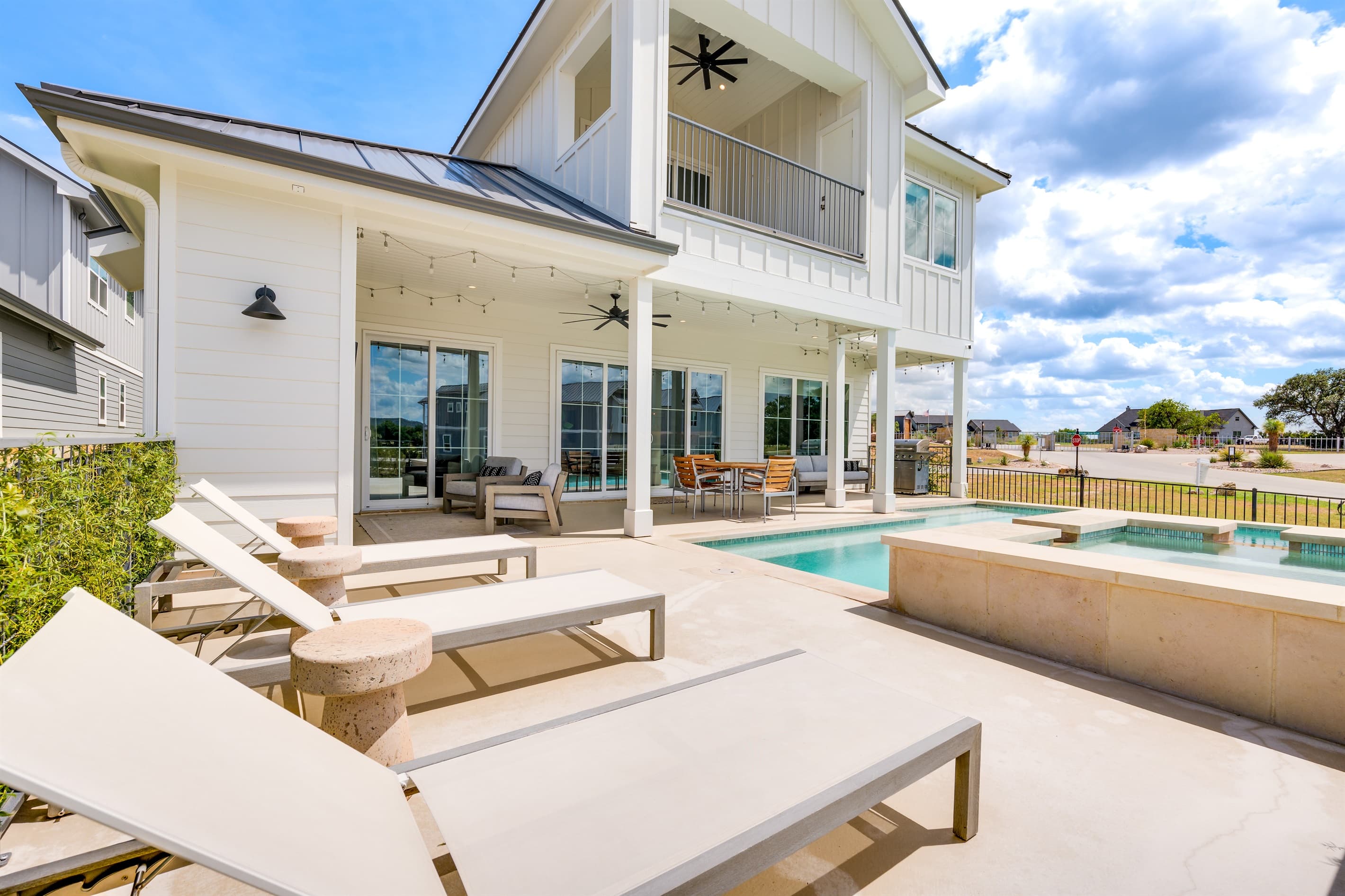 Outdoor patio with lake views with lounge chairs for relaxing