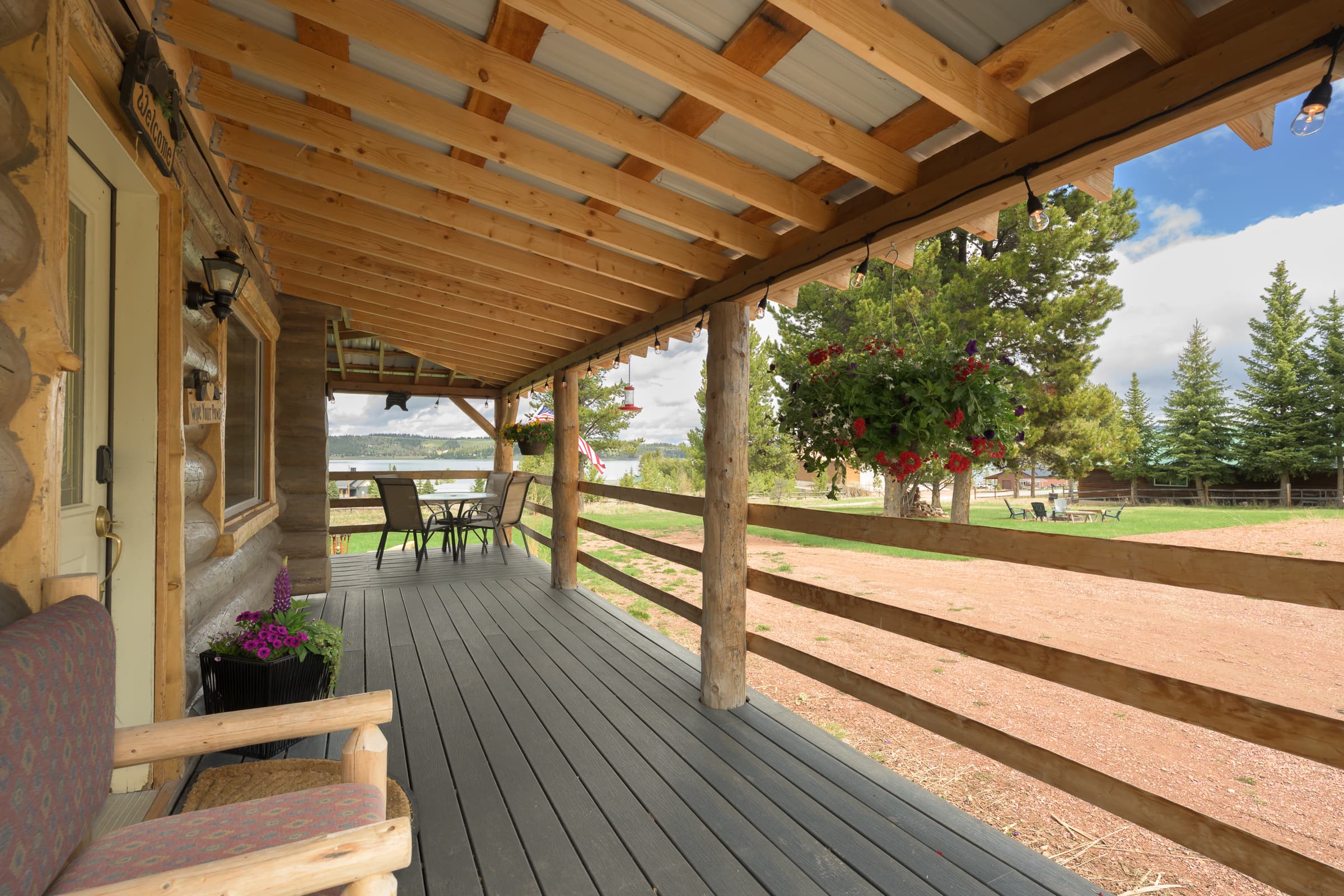 Large deck with dining for those lake sunsets or rainy days at the cabin