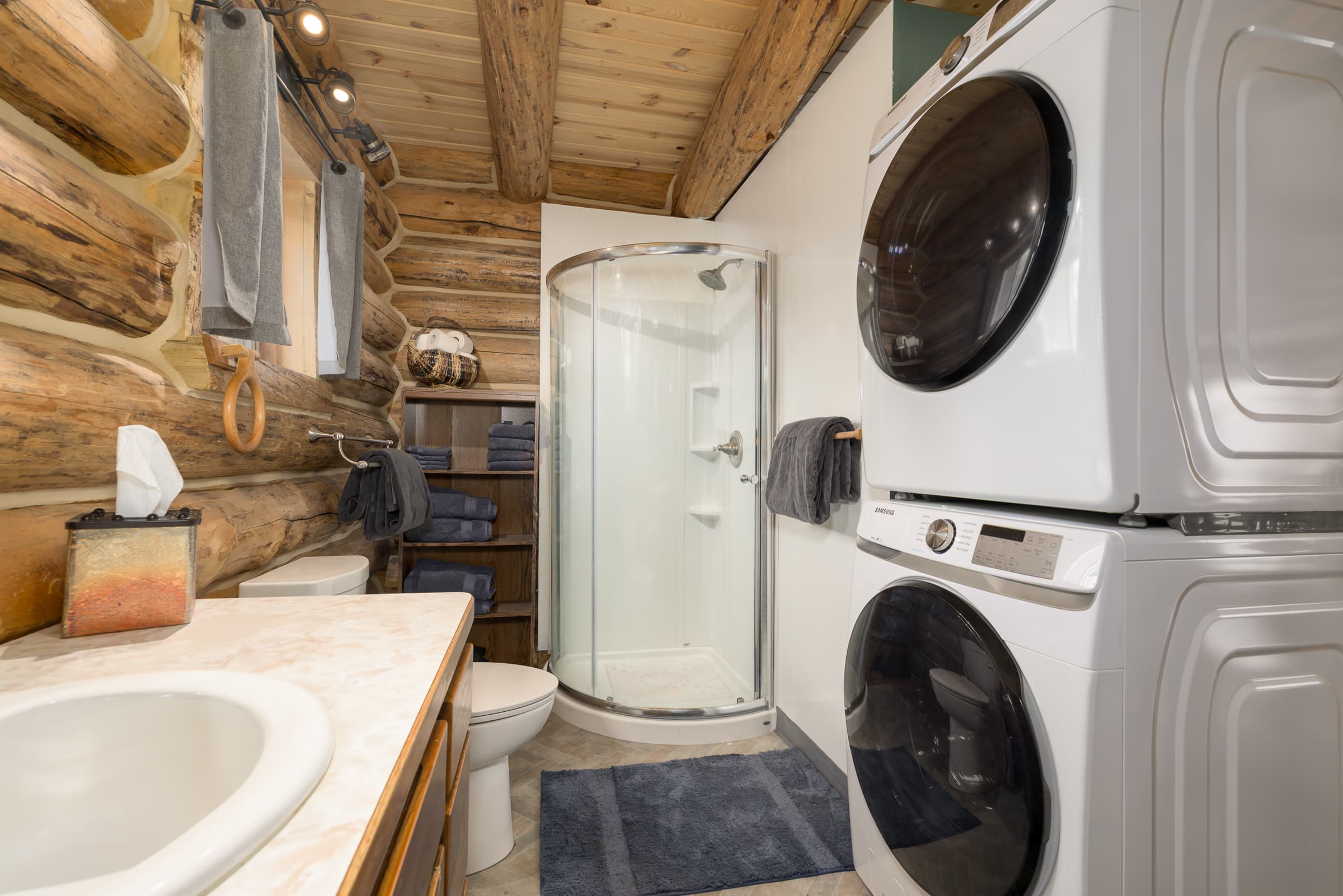 Bathroom off primary bedroom, with full washer & dryer