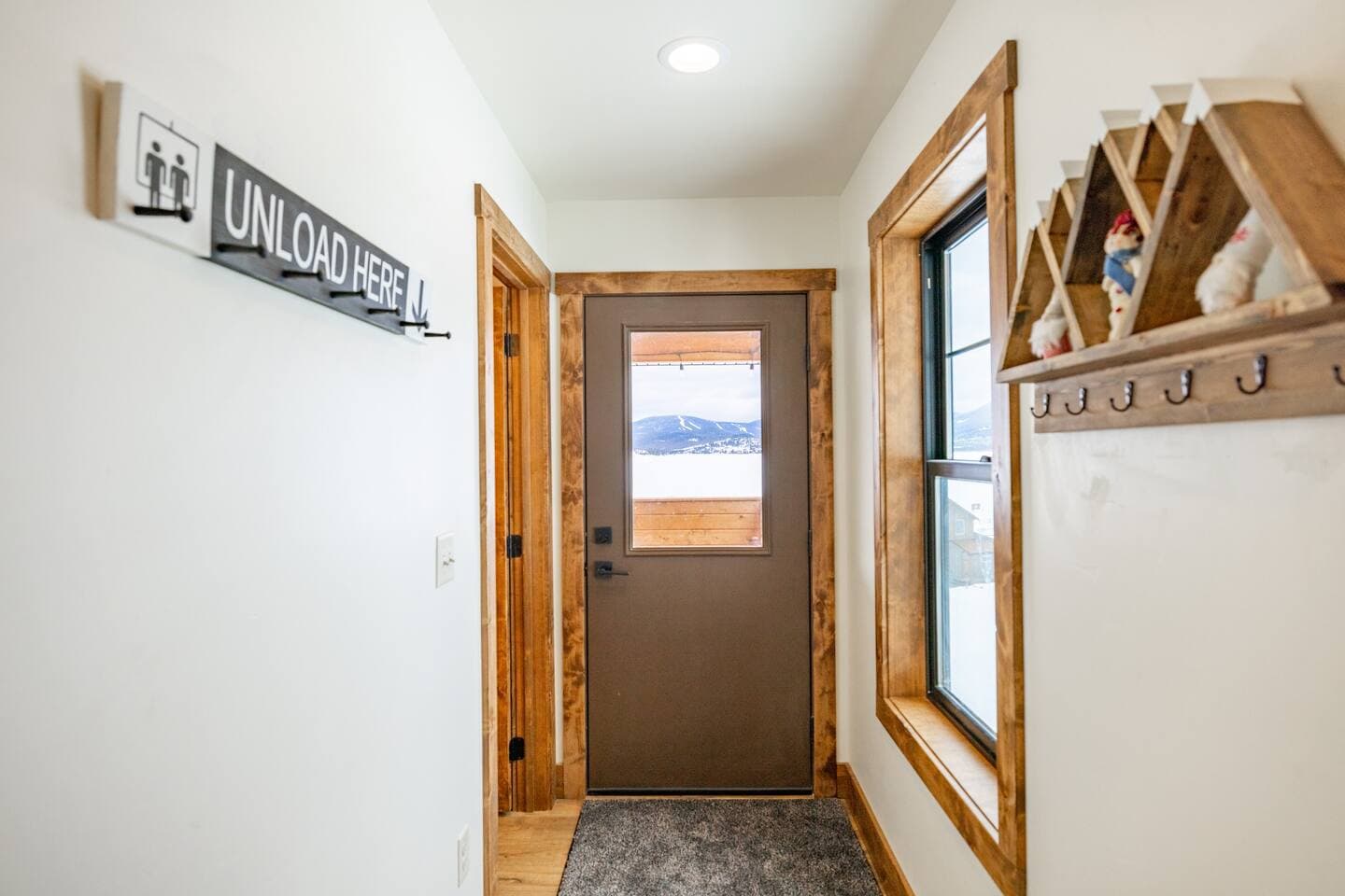 Enter into the mudroom to drop your boots; head through this door to the expansive deck. 