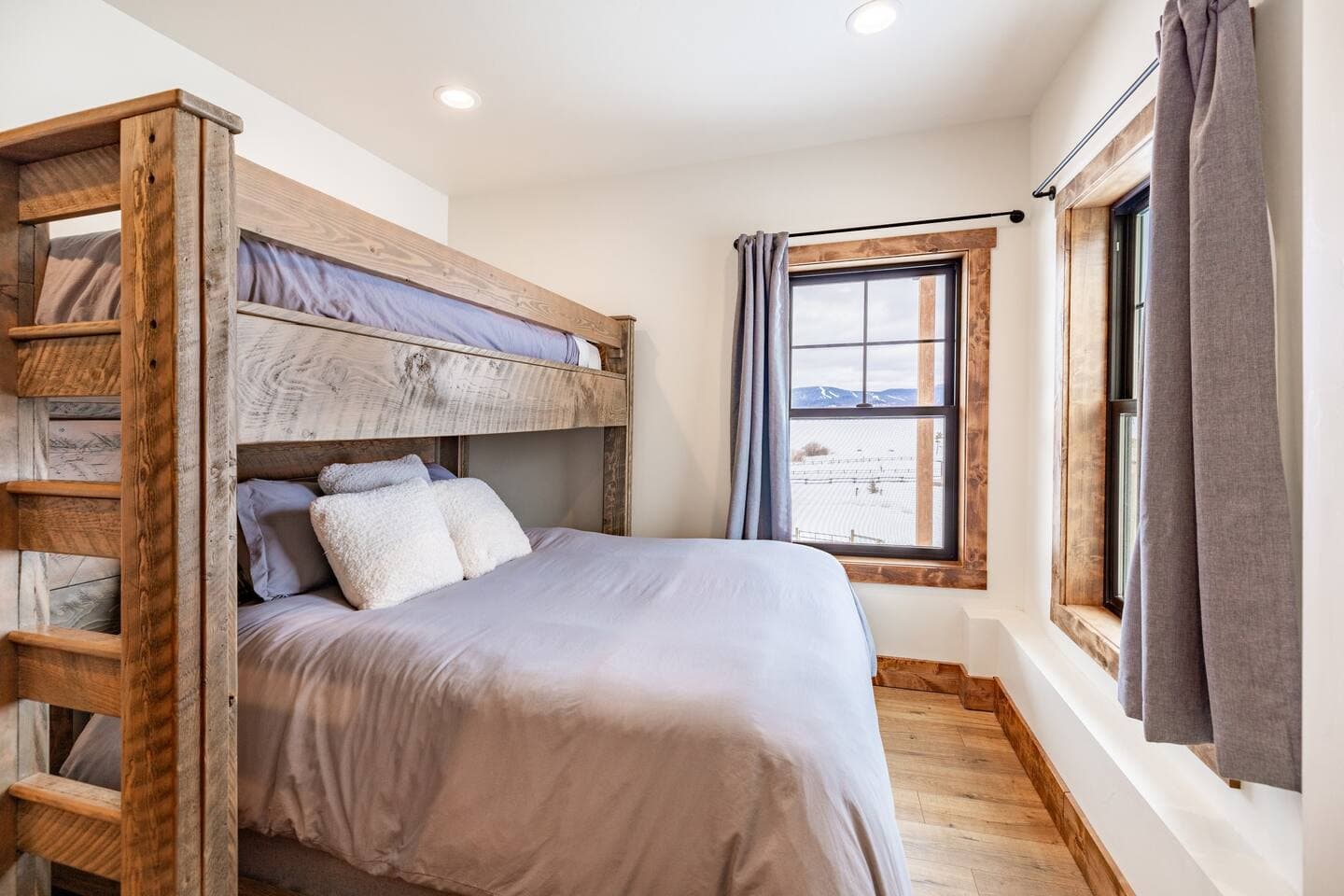 The 2nd bedroom has a queen bed with single bunk overhead, with some of the best views in the home!