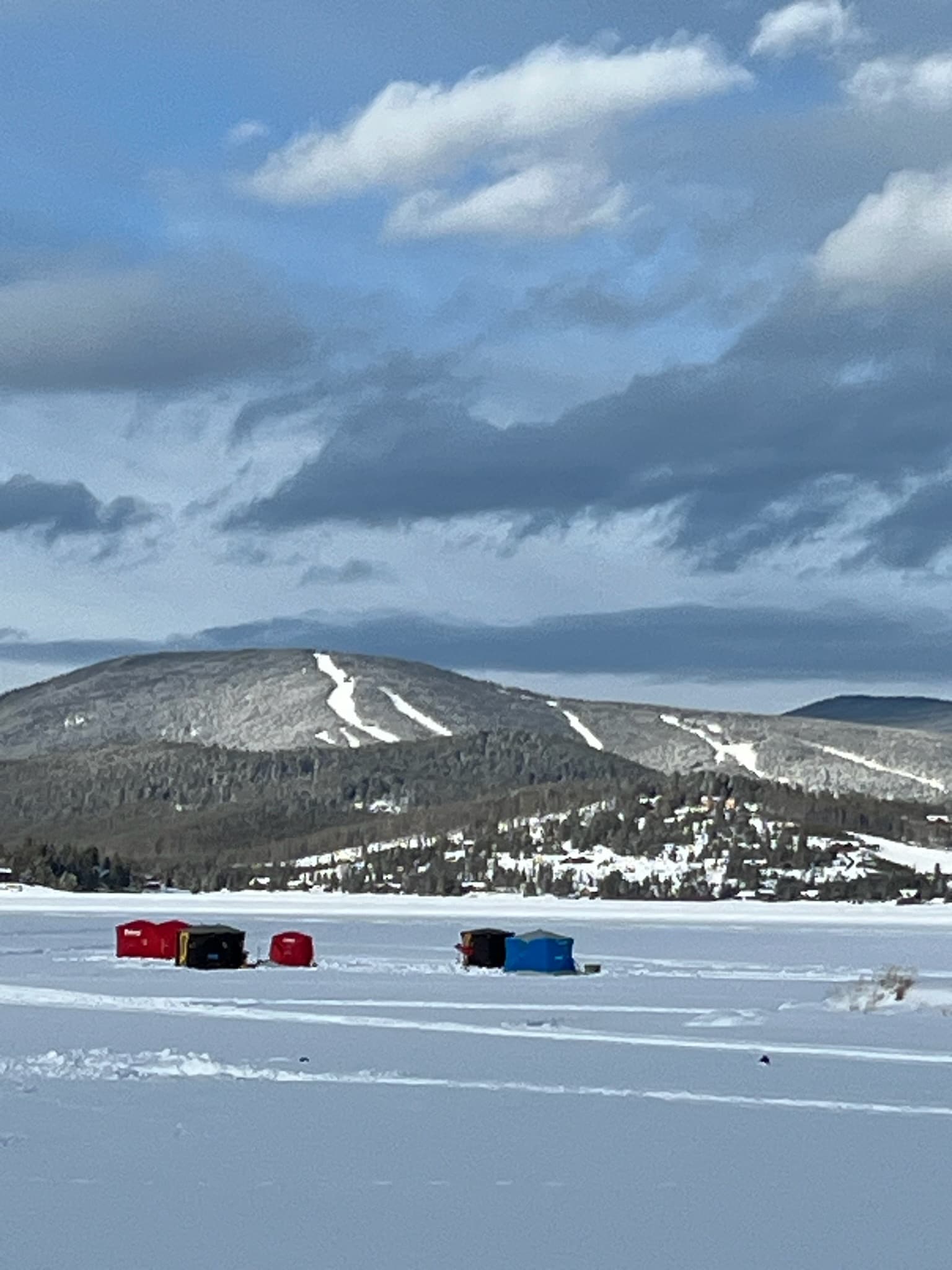 Ice Fishing on Georgetown Lake with Ski Discovery in the background