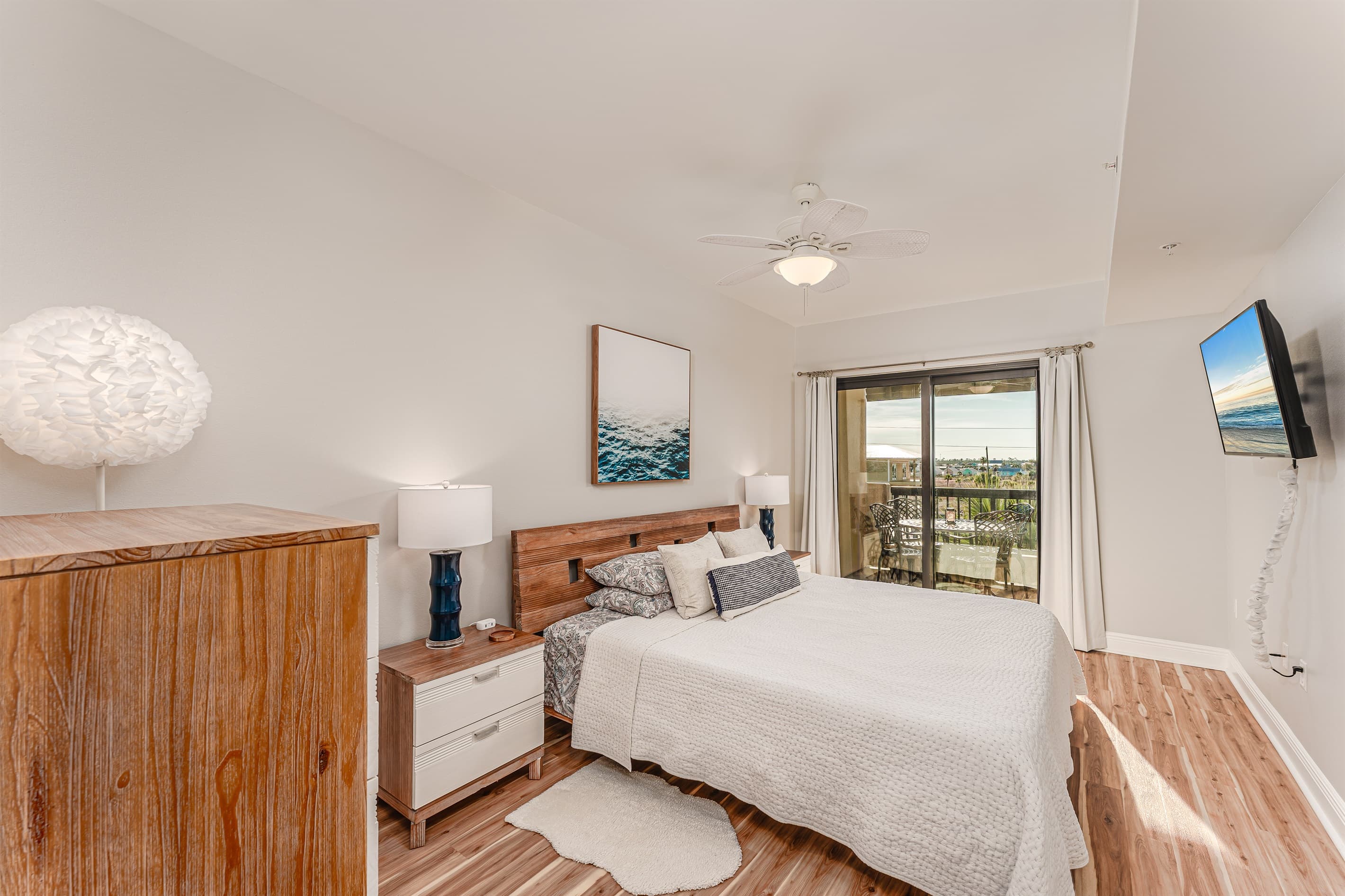 Gorgeous master bedroom with Smart TV and balcony access