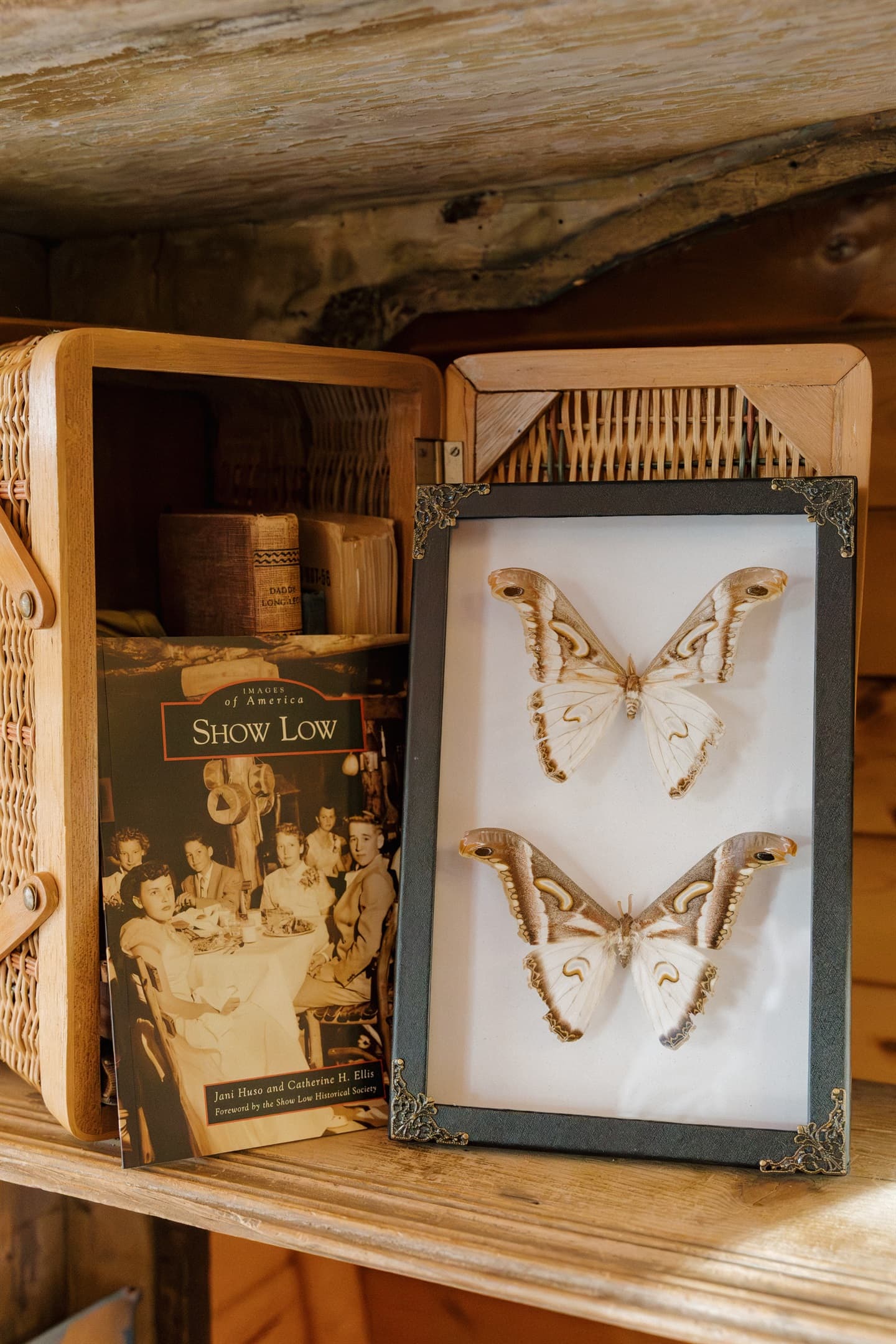 Curated decor celebrates Show Low's heritage at Poppywood Pines. Thoughtful touches and local history books create an authentic White Mountains experience. This pet-friendly cabin blends rustic charm with modern comfort for your Arizona mountain getaway.