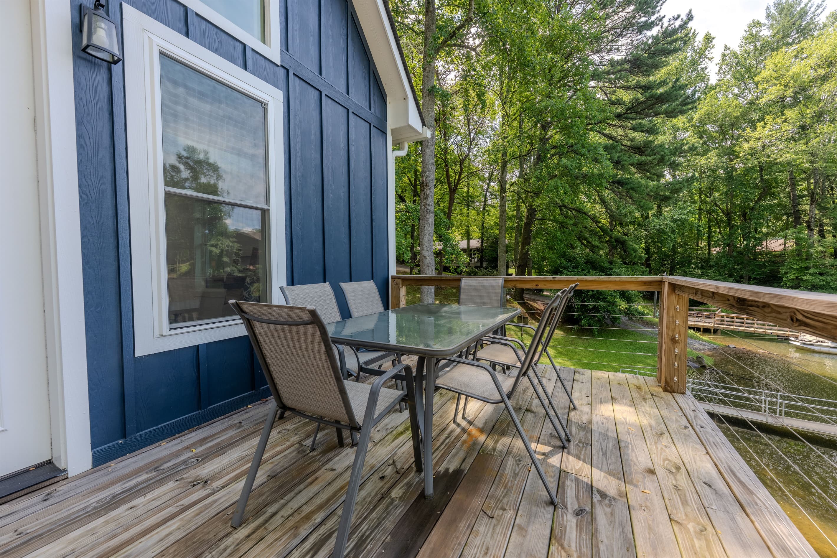 Main level- Deck with lake views, smoker, and outdoor dining