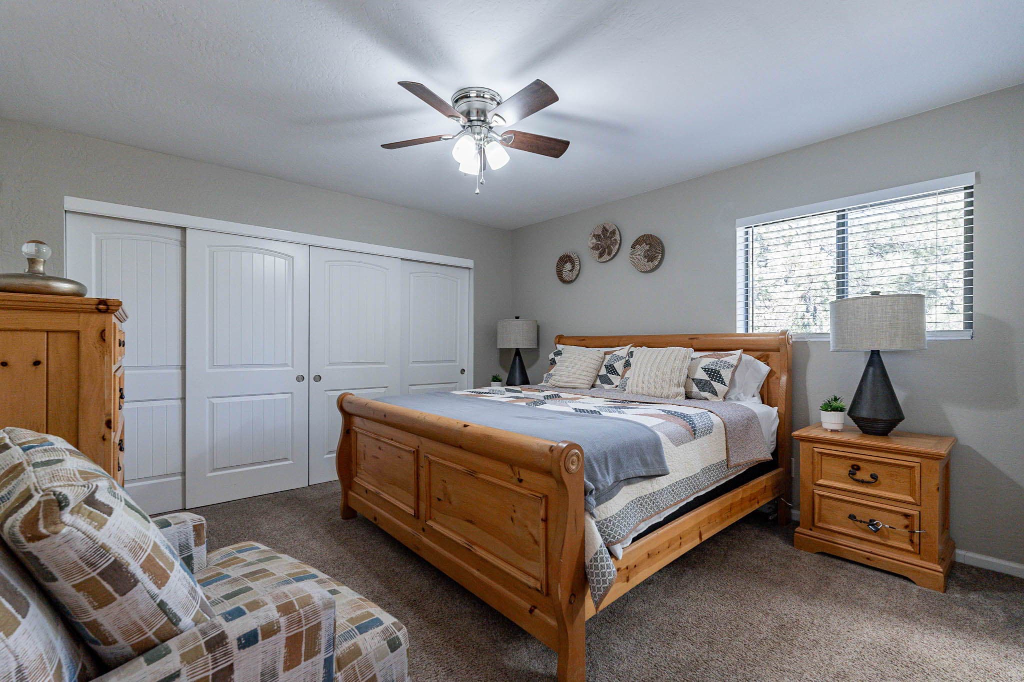 Comfy king bed in the upstairs primary bedroom.