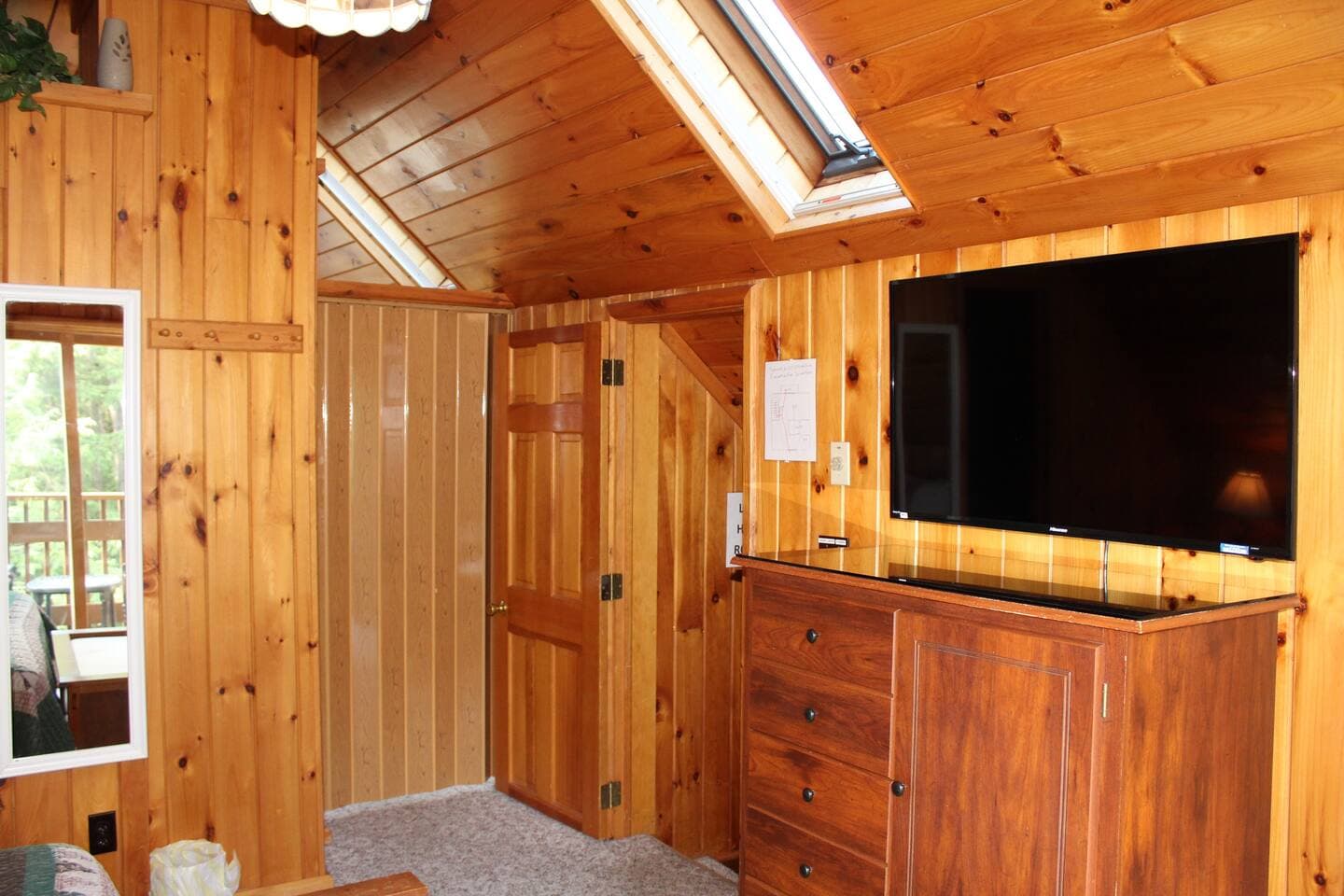 Entrance to bedroom #5 - railroad style access through bedroom #4 (king bedroom)Shown with folding door closed.