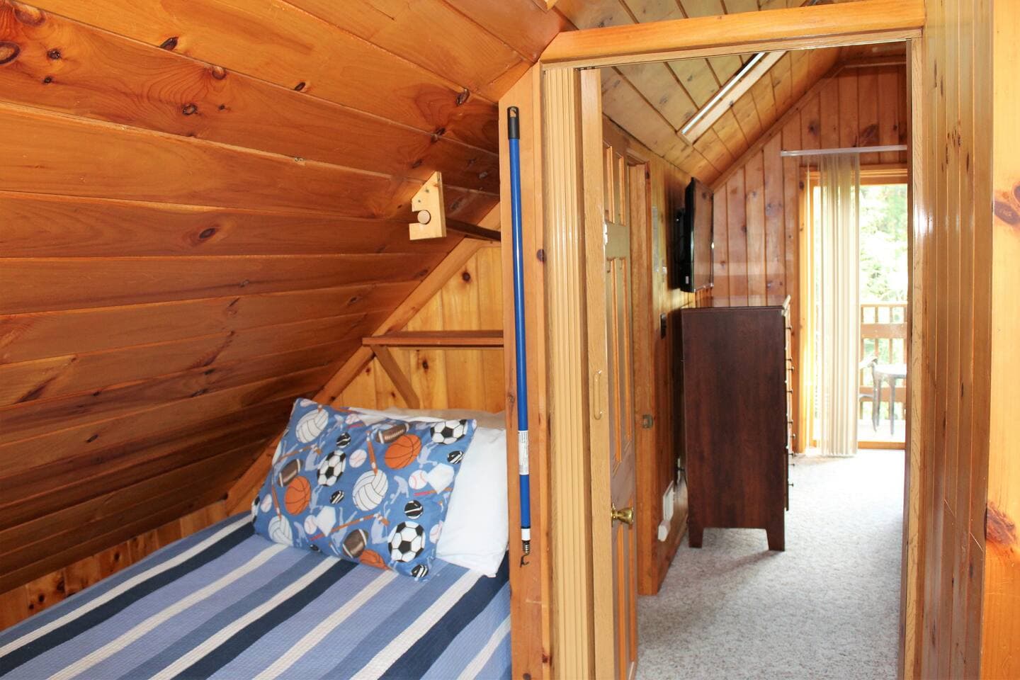 Entrance to bedroom #4 (king bedroom) from bedroom #5(twin bedroom) - railroad style access.Shown with folding door open.