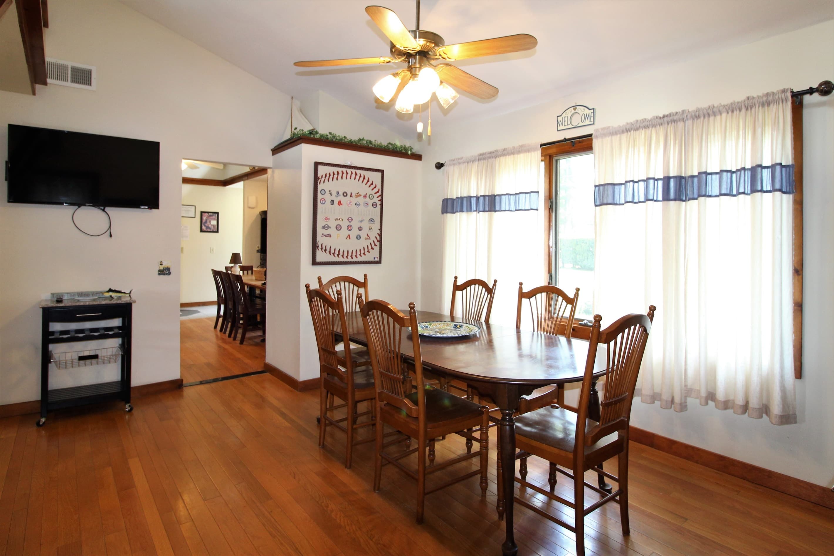 Main Dining Area with flat screen smart Roku TV to keep up on the scores while making dinner