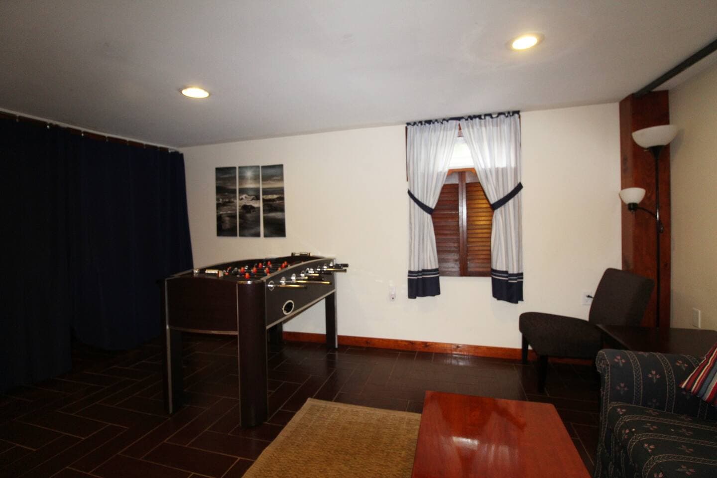 Lower level family suite living area with foosball table for recreation