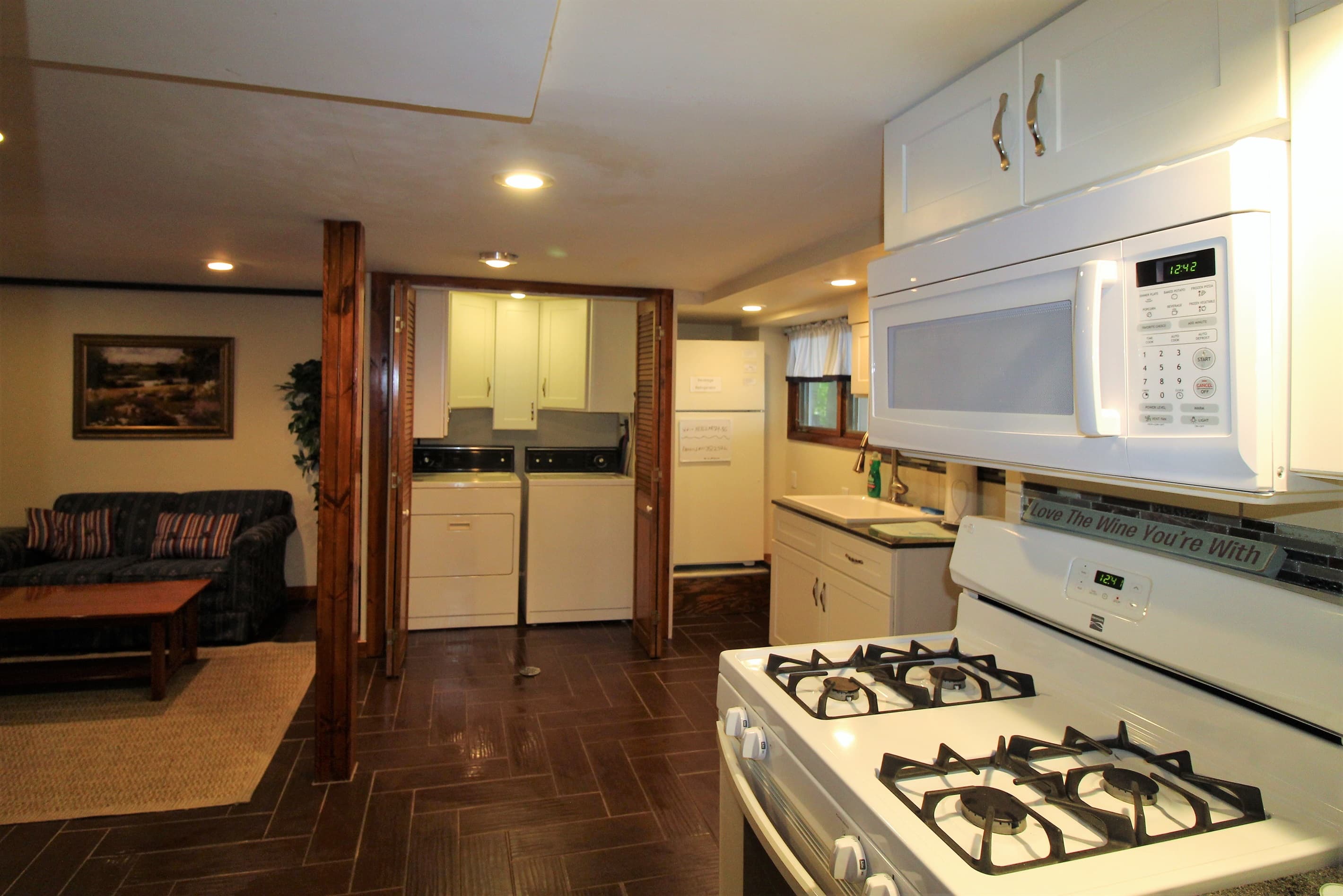 Lower level laundry area and summer kitchen
