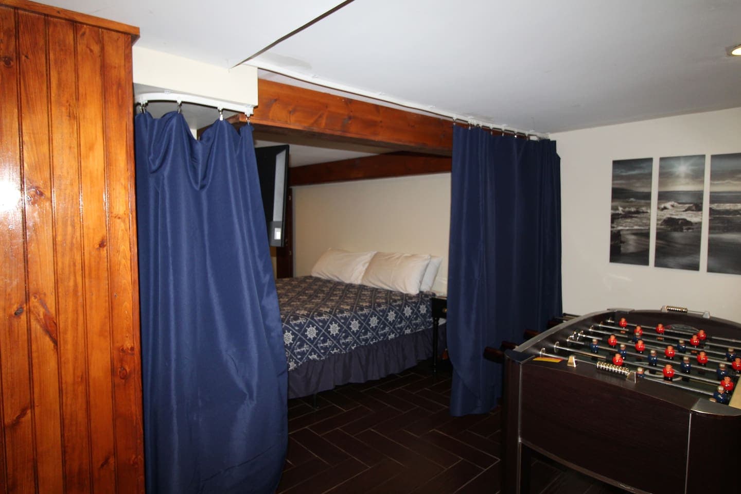 Bedroom #3 with king size bed off of lower living area, adjacent to bedroom #2 (2 twin beds).  The living area of the family suite is separated from the king bedroom area by a sliding curtain partition.  