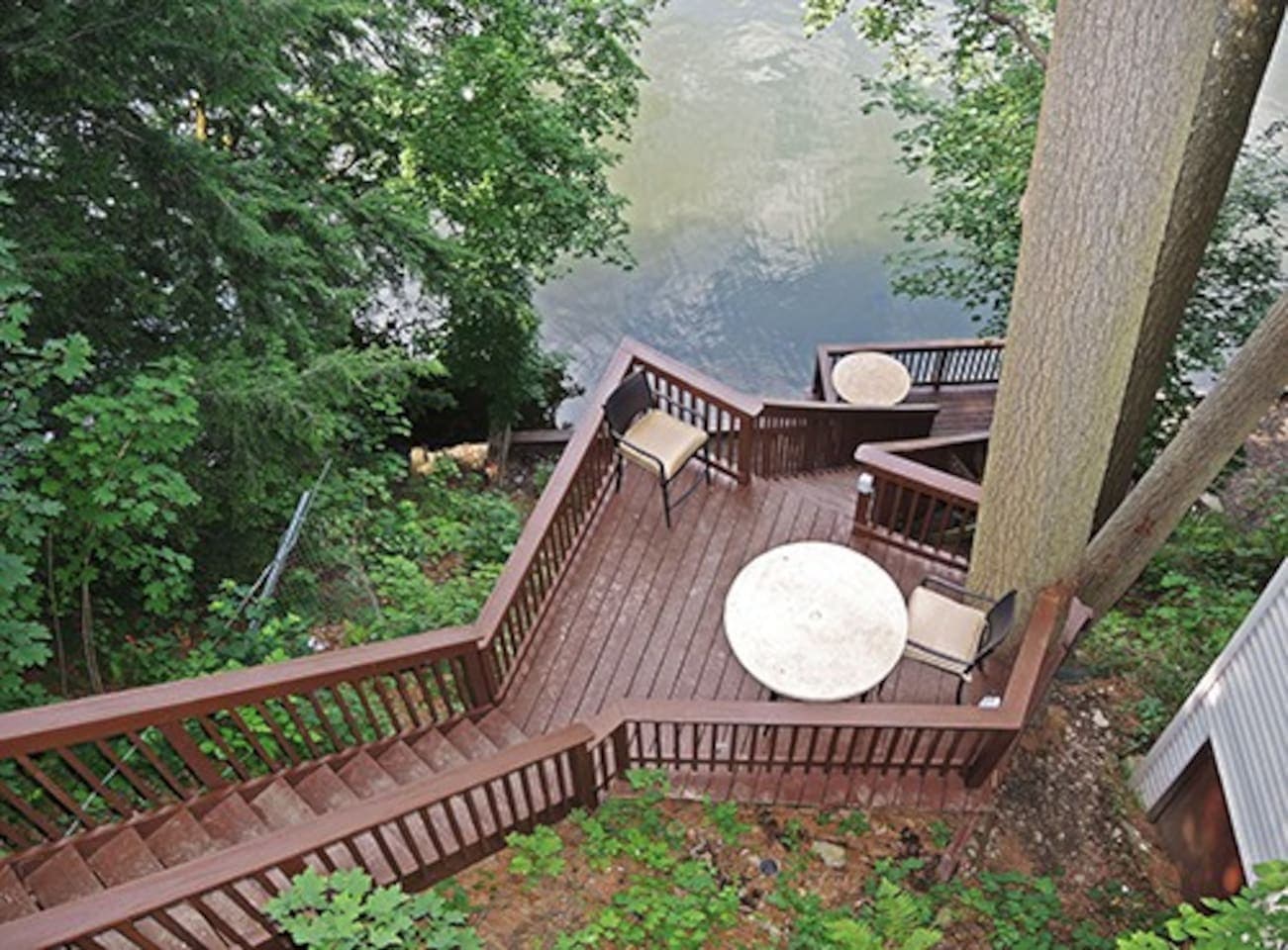 Multi-tiered deck as seen from the top - Kayaks with PFD's, a fire pit and fishing poles are available at the water's edge