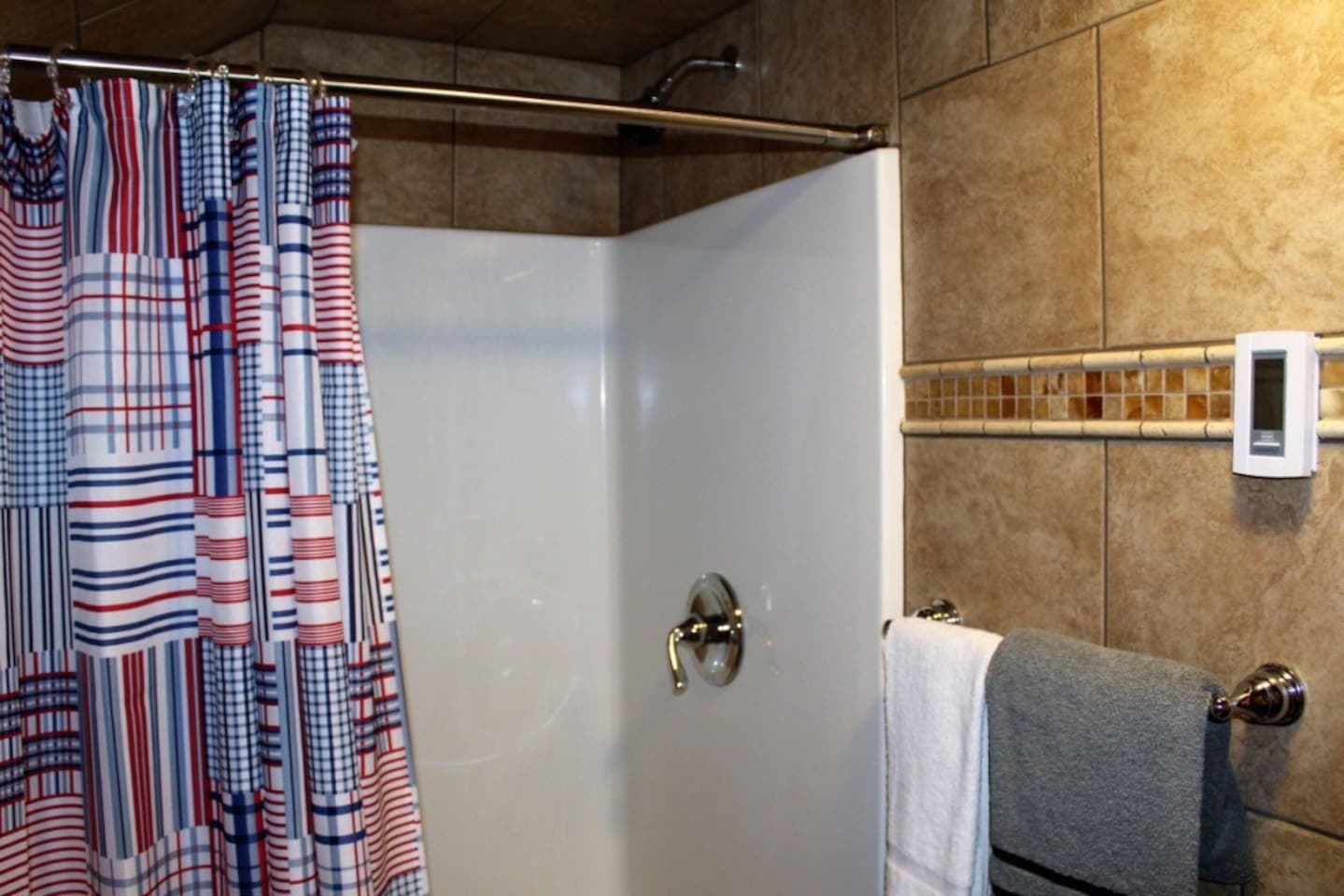 Bathroom off bedroom #4, main level, with stall shower and separate lavatory area