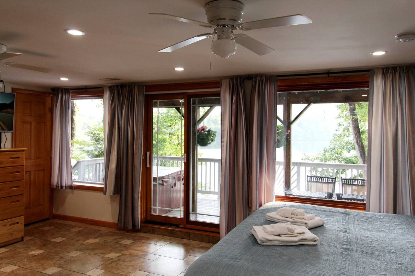 Lots of windows for a perfect view of the lake, and just steps away from the hot tub on the deck.