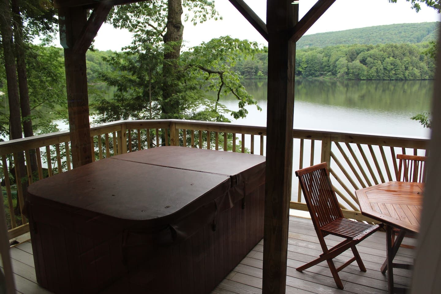 Lower level deck with hot tub overlooking the lake