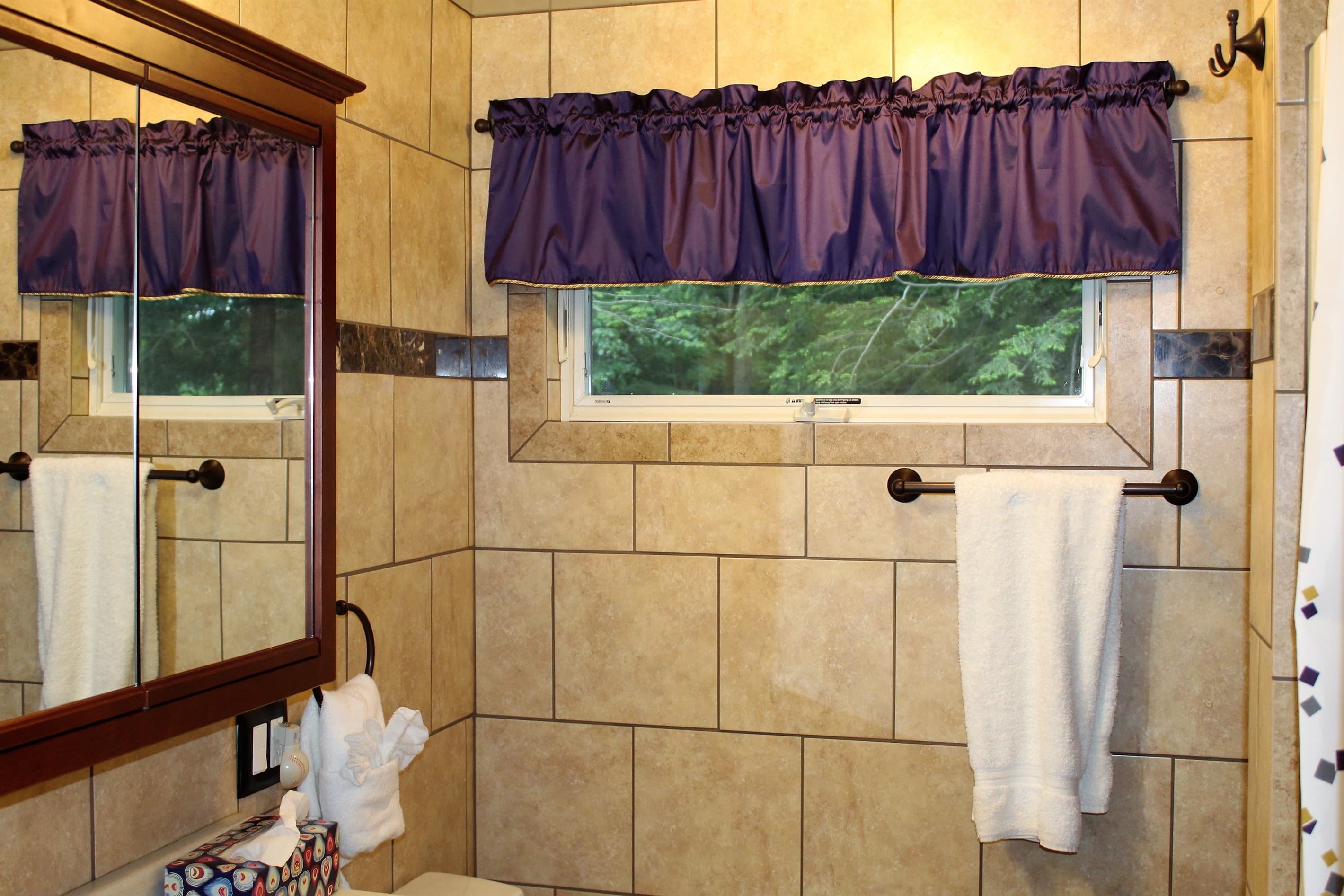 Upper level fully tiled bath with stall shower and heated bathroom floor