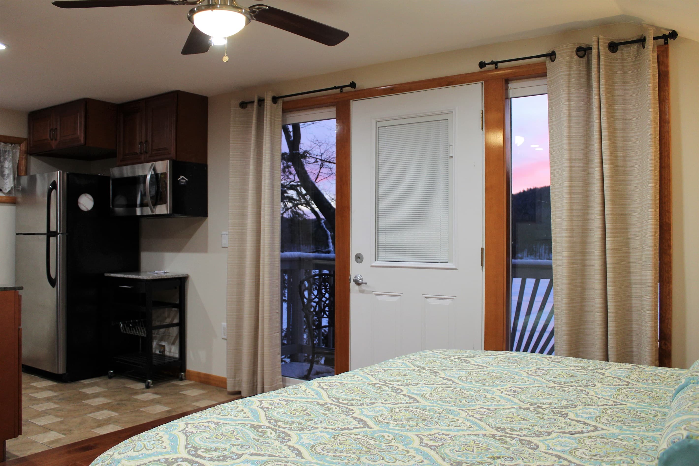 Bedroom #5 with private balcony overlooking the lake