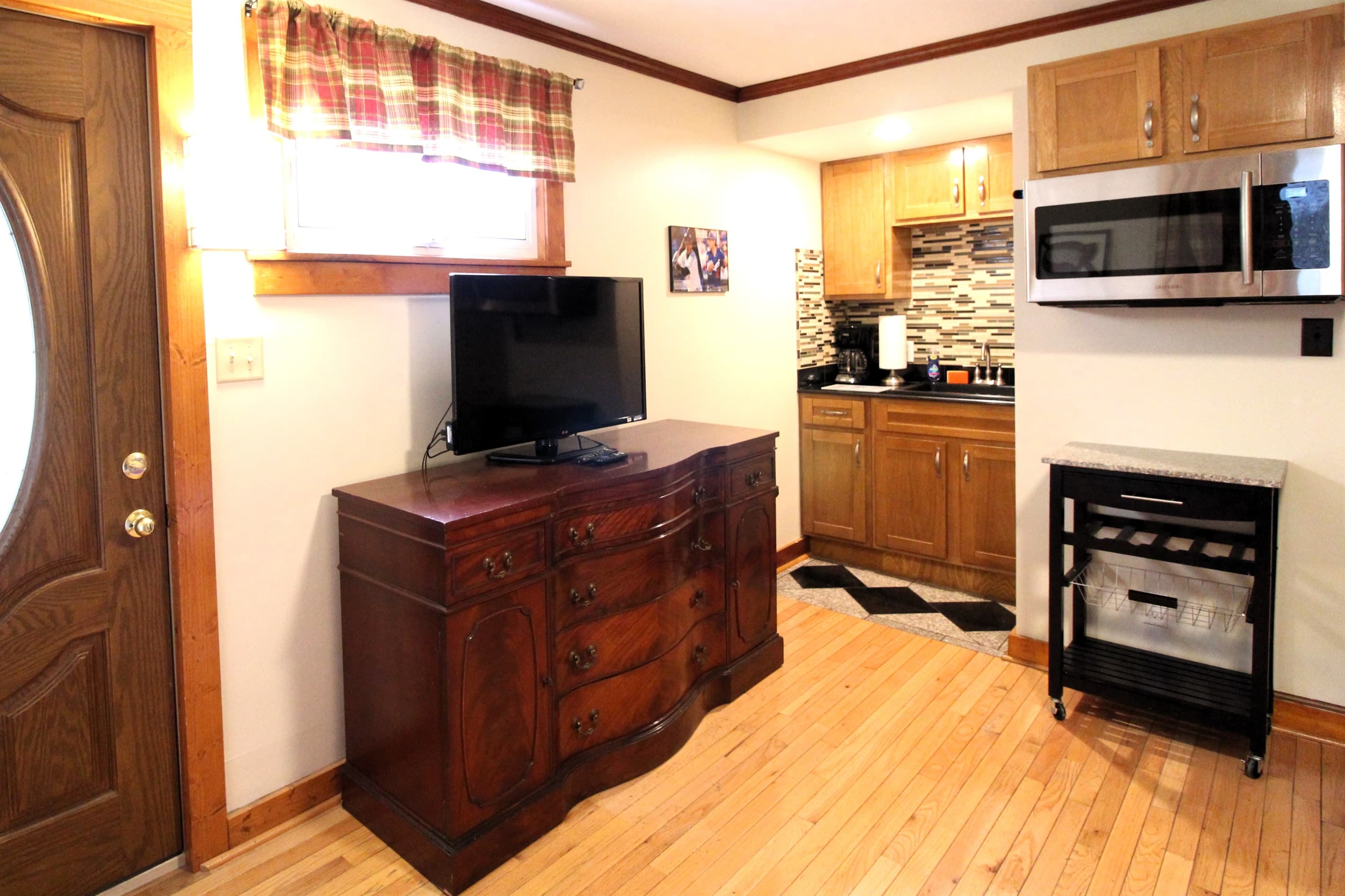 Bedroom #5 with large flat screen smart Roku TV and wet bar with microwave