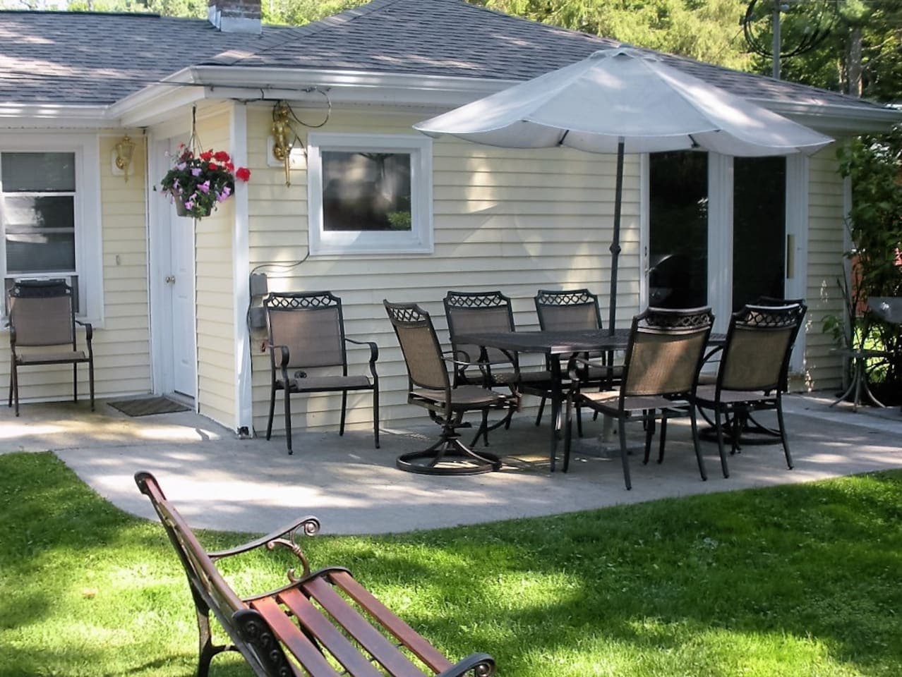 Patio for outdoor dining and conversation with gas grill and fire pit for campfires and s'mores