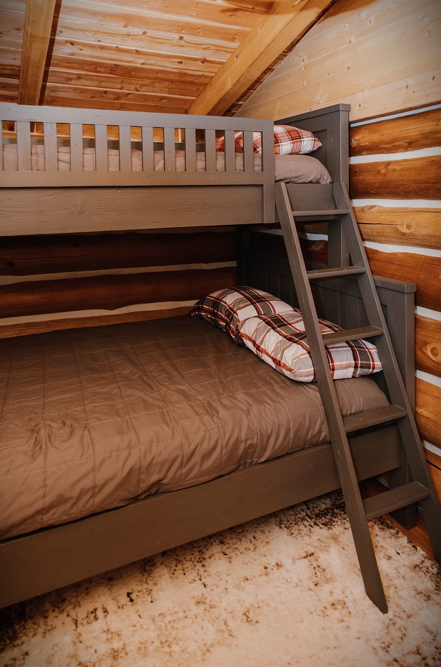 The bunk house, located behind the main house, features a twin over full bunk bed.