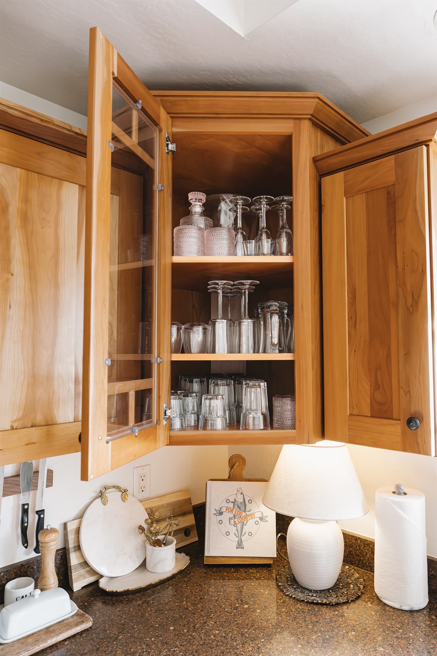 Fully stocked kitchen with glassware for every occasion—wine glasses, tumblers, and bar essentials ready for cozy nights in or relaxed dinners at Attiwood Ridge.