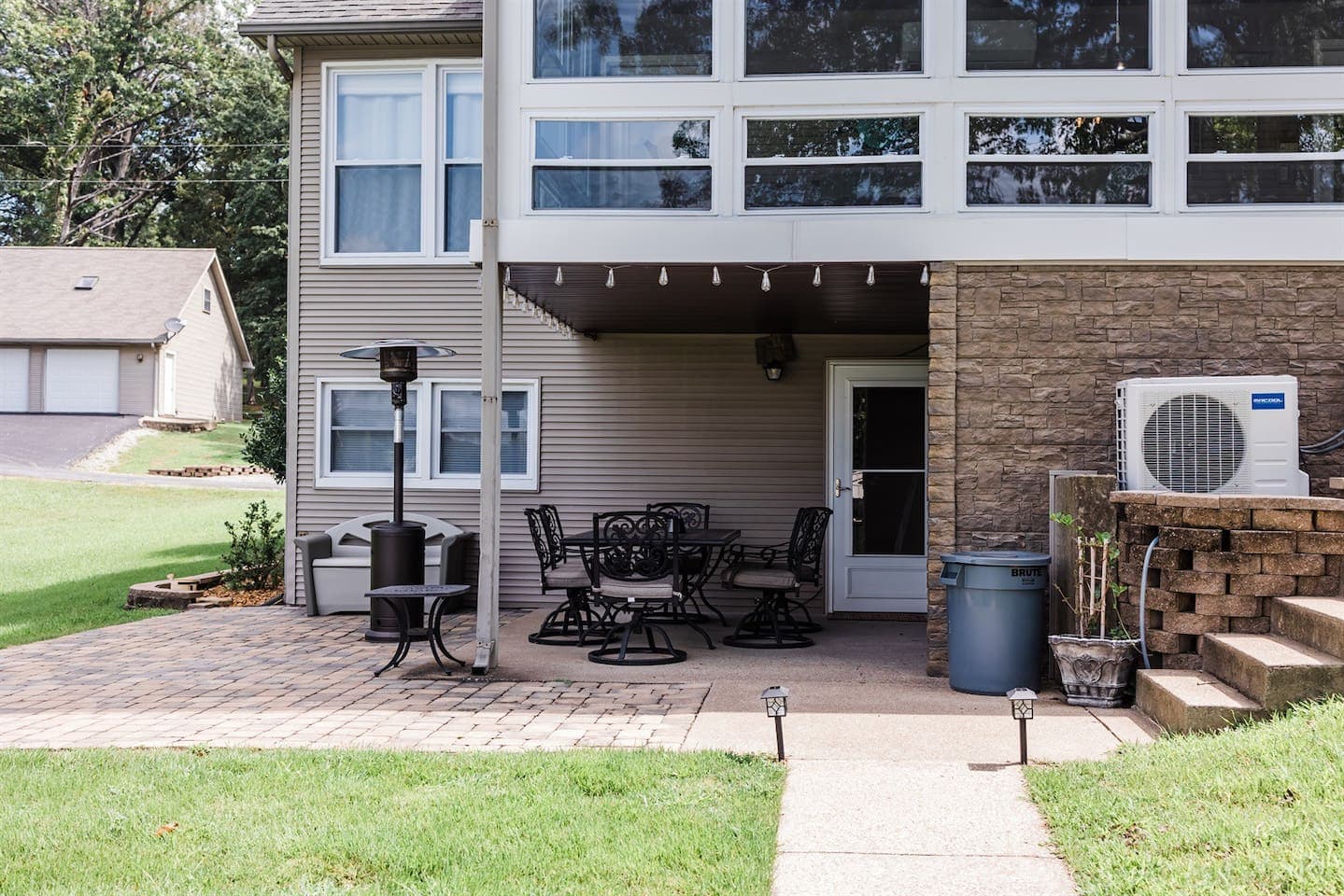 A cozy home with a patio and deck, perfect for outdoor relaxation and entertainment.