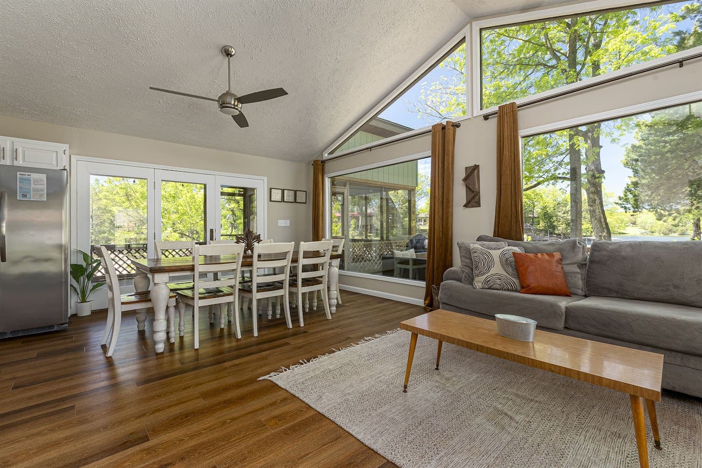 Cozy living room with big window & comfy couch.