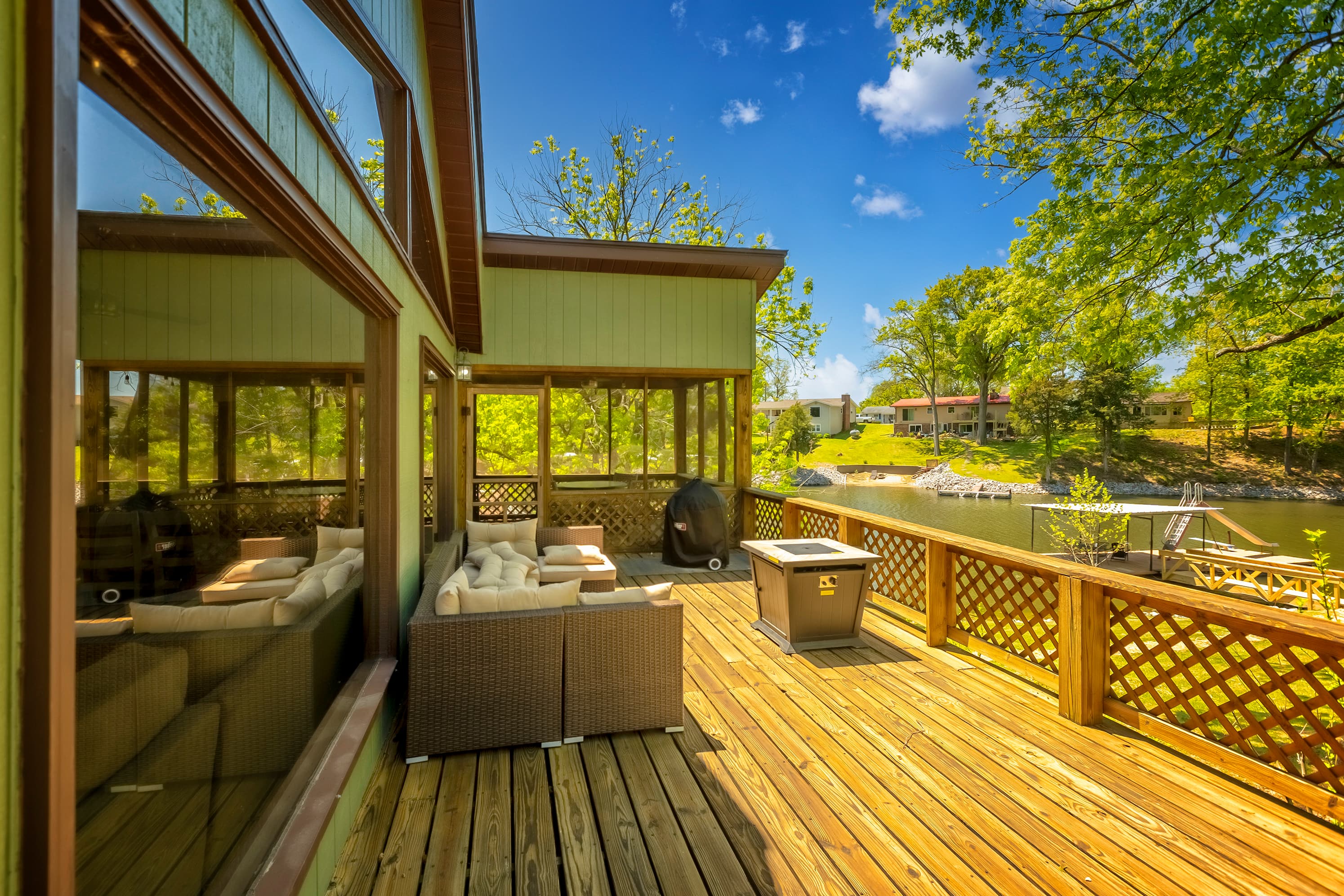 Ample outdoor seating with fire pit and grill 