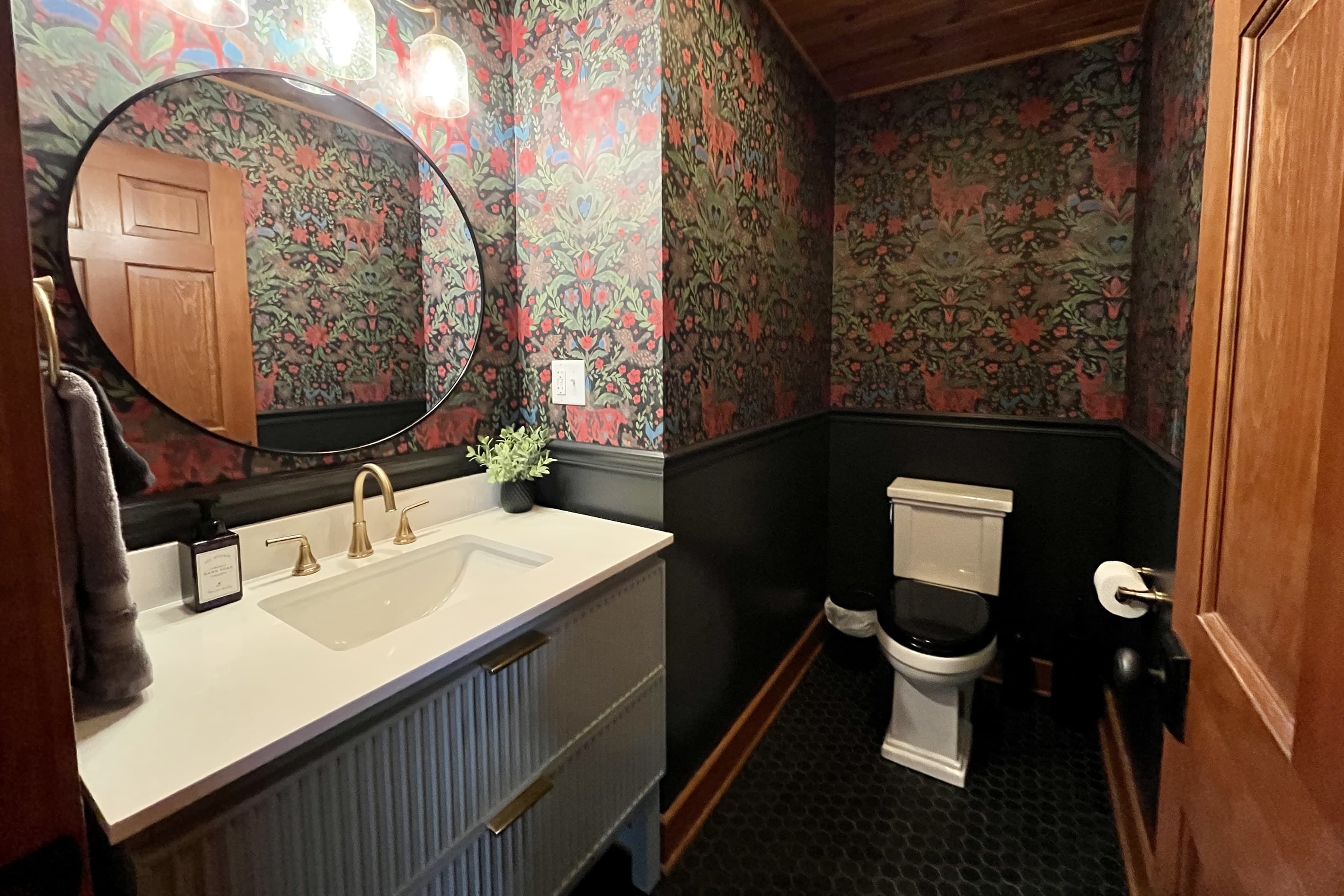 Demure half bath off living room