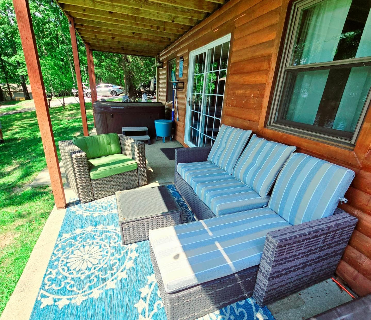 Seating on lower level patio by hot tub