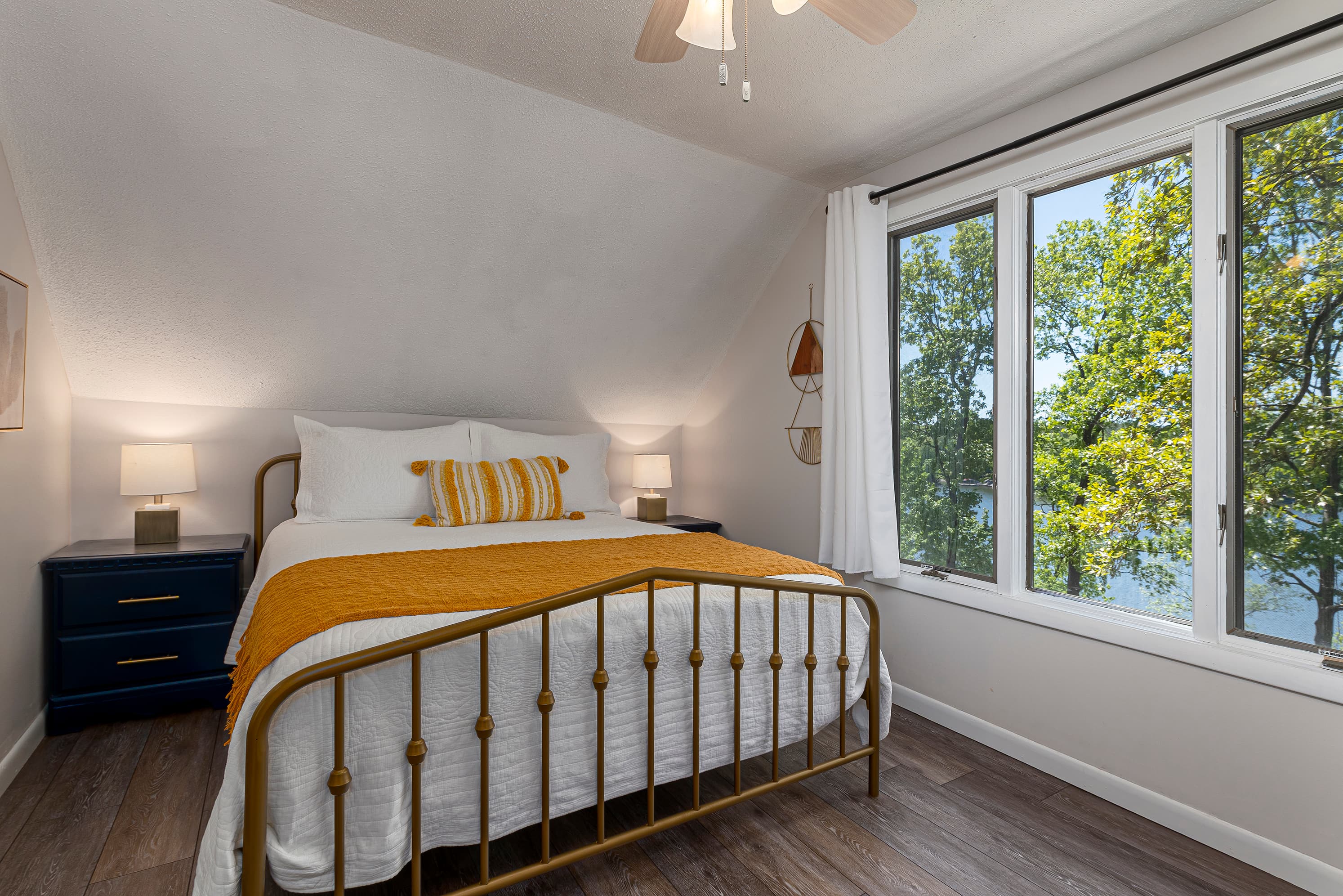 Upper level queen bedroom overlooking lake