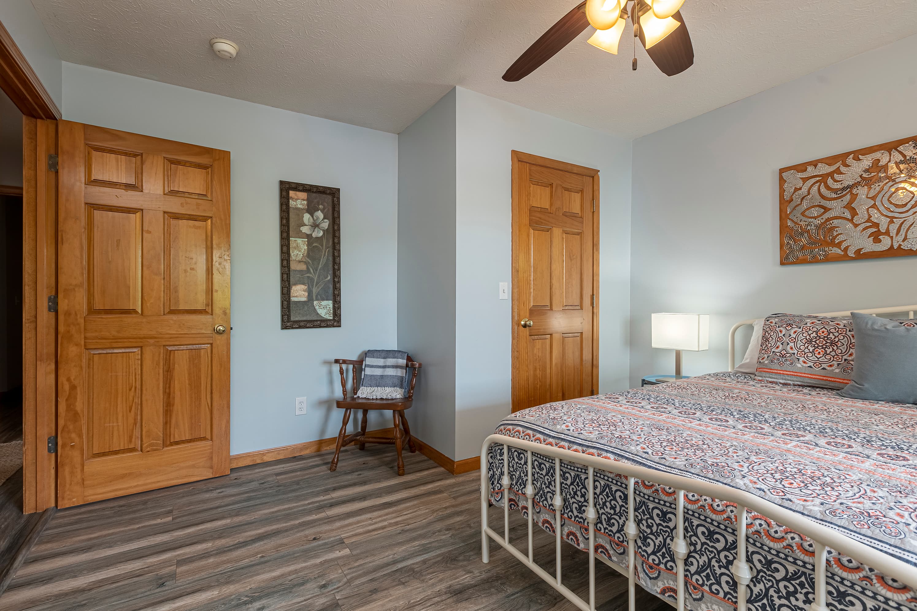 Main level bedroom with king bed