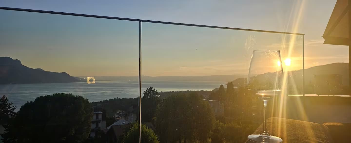 Ground-floor terrace with kitchen, BBQ, and pergola. Views of the mountains and Lake Geneva.