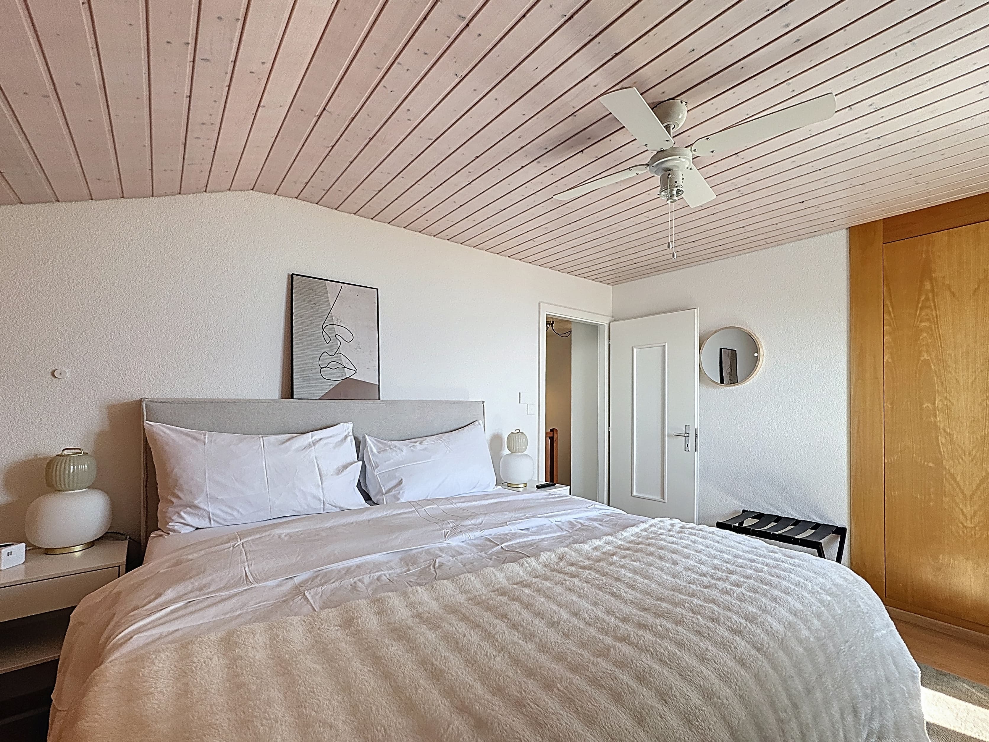 Master bedroom with view of the mountains and Lake Geneva on the 1st floor