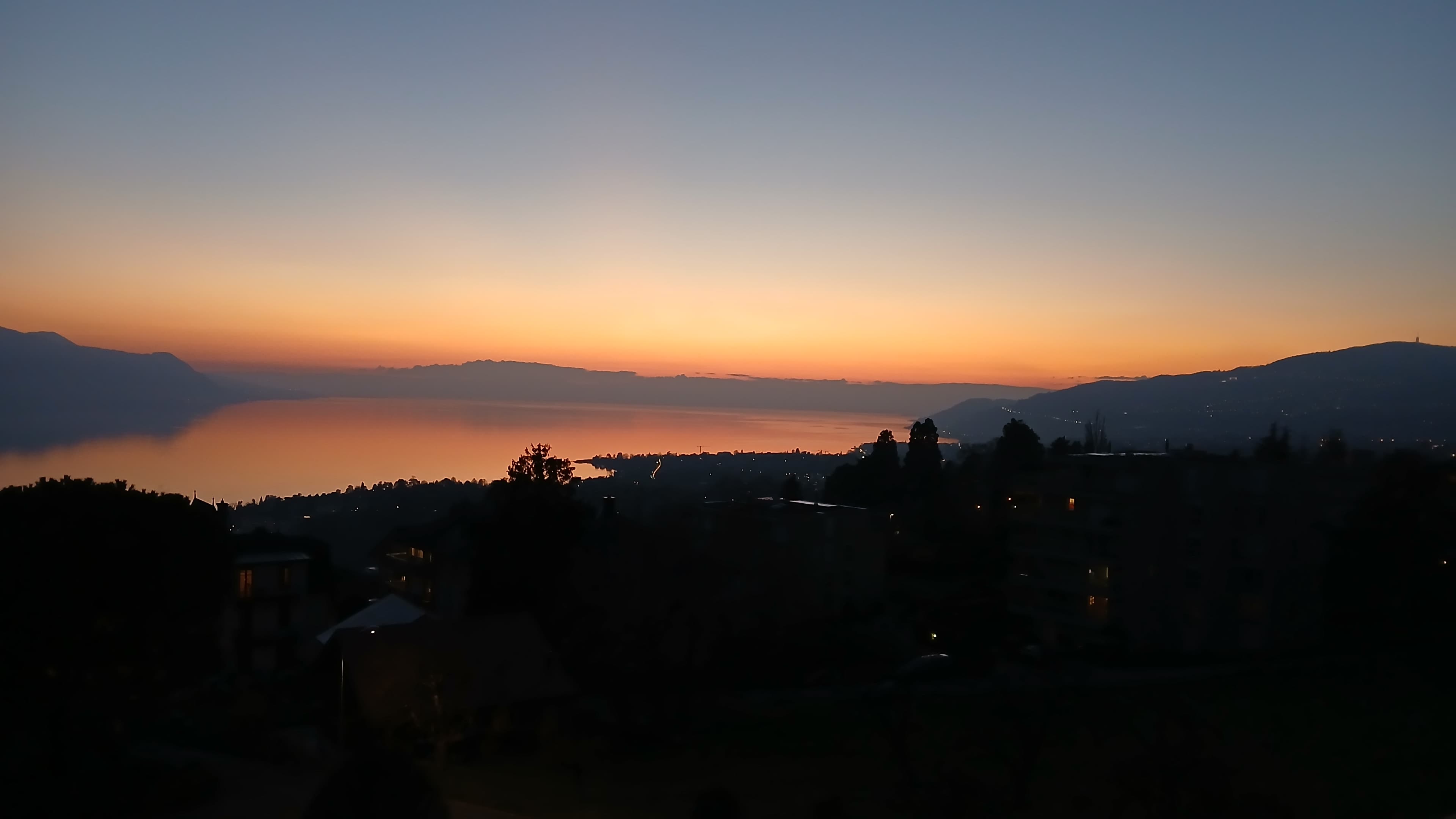 Riviera House, view from the villa of the mountains and Lake Geneva with a sunset.