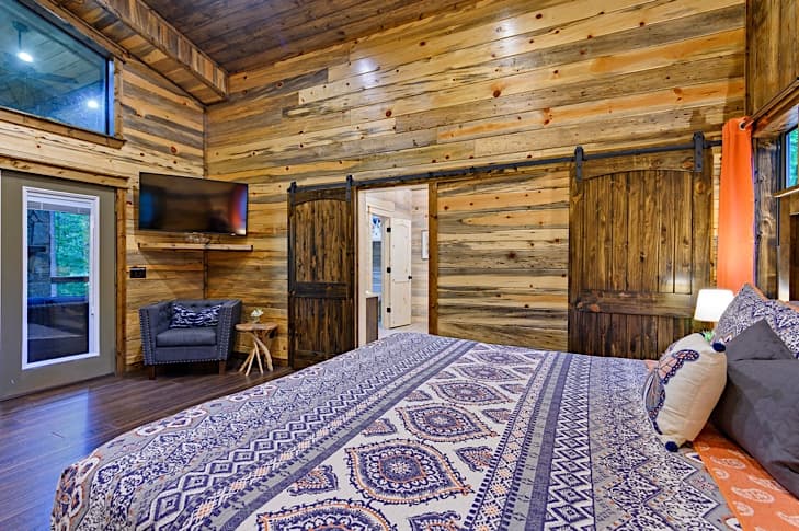 Smart TV and reading nook in spacious bedroom
