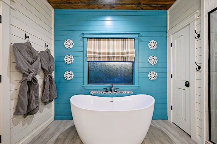Inviting soaking tub and cozy robes