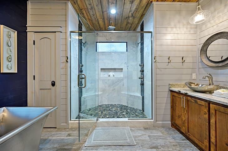 Luxurious walk-in shower with dual heads, body jets and rain head