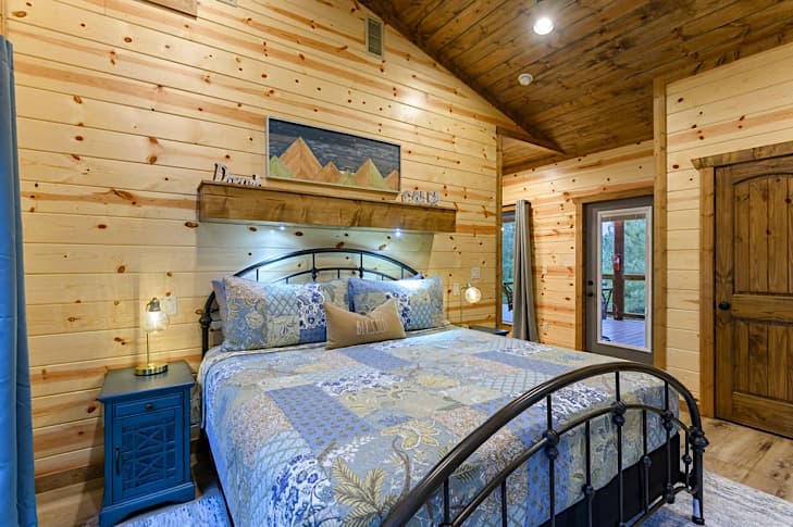 Private king bedroom and overhead shelf with recessed lighting for reading