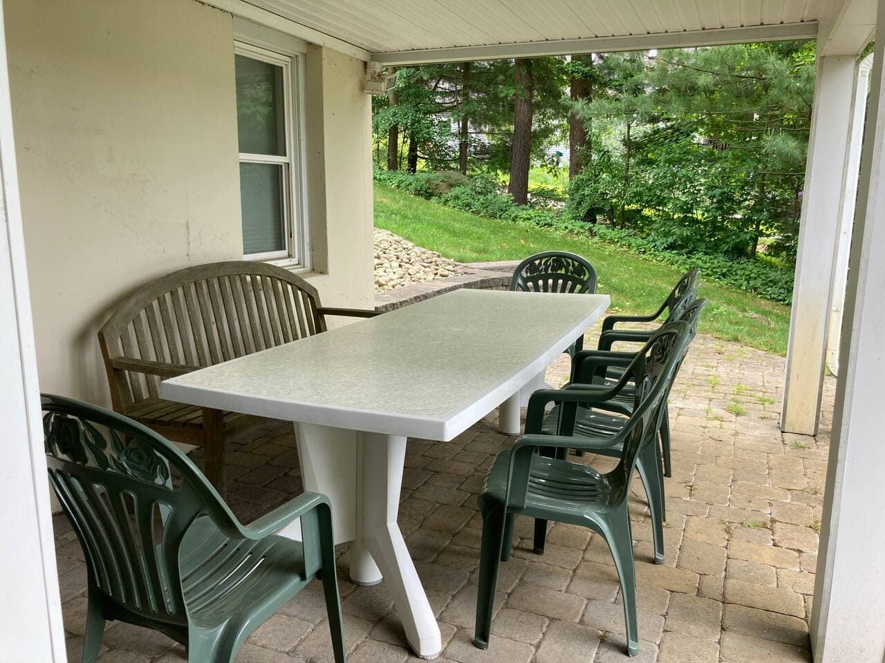 Eat outdoors protected from the sun and rain on lower level patio.
