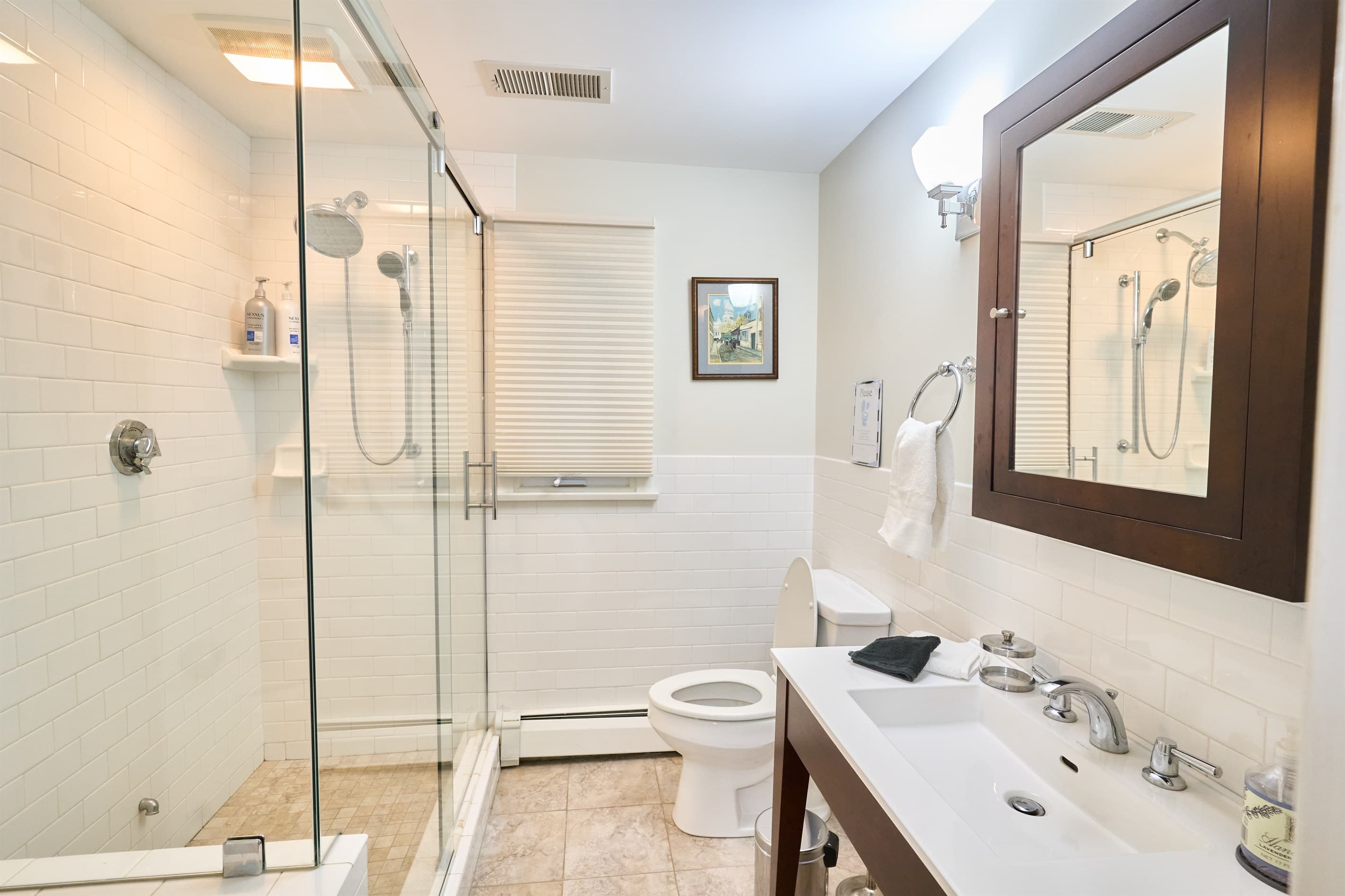 Bathroom on the upper level. Entry is a couple of feet from the door to the bedroom with the queen size bed. 